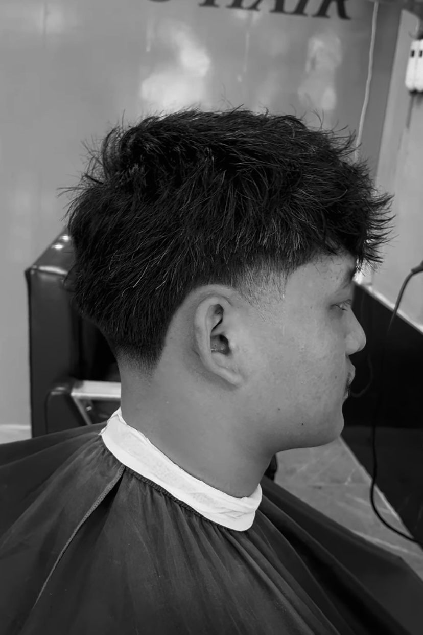 Textured mid fade with styled top